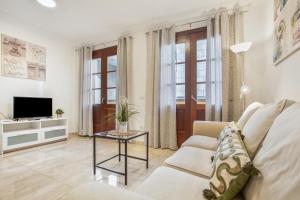 TV a/nebo společenská místnost v ubytování Apartamento Rolycar 103