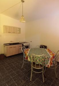 a kitchen with a table and chairs in a room at Departamento Dai in Jesús María