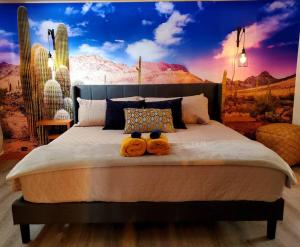 two teddy bears sitting on a bed in a bedroom at The Western Spa Sauna Bar & Billiards in Valcartier Station