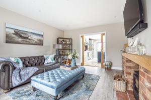 Televiisor ja/või meelelahutuskeskus majutusasutuses Olive's Cottage