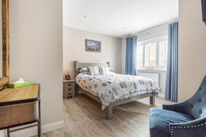 Voodi või voodid majutusasutuse Olive's Cottage toas