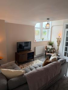 TV a/nebo společenská místnost v ubytování Luxury flat in the beautiful village of Botley