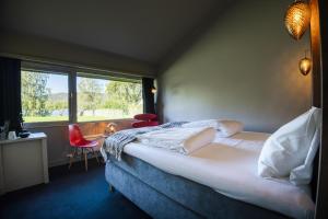 Postel nebo postele na pokoji v ubytování Thorbjørnrud Hotell + 99 fotografií