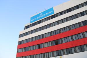 a building with a blue sign on top of it at Arrey Express Hotel - Teresina in Teresina