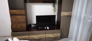 a tv sitting on a dresser in a room at Studio 6-2 Hristo Stanechev 2- Dental University in Bŭnzareto
