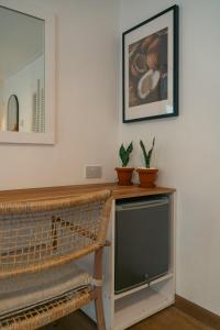 Μια τηλεόραση ή/και κέντρο ψυχαγωγίας στο Beau Vallon Bungalows