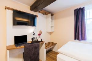 Μια τηλεόραση ή/και κέντρο ψυχαγωγίας στο Hotel Scheffler Lüneburg