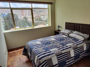 En eller flere senge i et værelse på Departamento céntrico