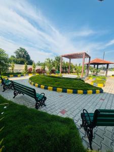 a park with benches and a gazebo at VINTAGE VISTA RESORTs in Chennai