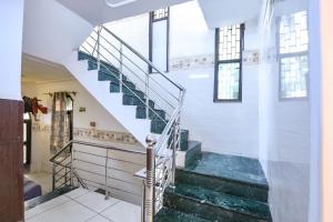 a staircase in a building with a glass floor at FabHotel Shiv Palace in New Delhi