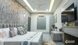 Ένα ή περισσότερα κρεβάτια σε δωμάτιο στο Avaani Residency