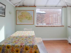 a bedroom with a bed in a room with a window at Hillcrest in Pickering