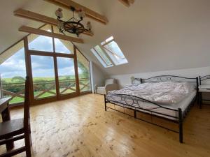 Ένα ή περισσότερα κρεβάτια σε δωμάτιο στο Ad Matrem