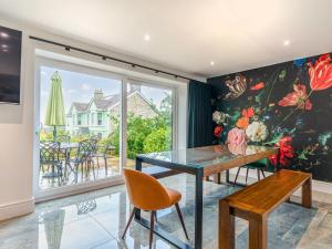 a dining room with a table and a window at The Aviary-Uk44382 in Callington