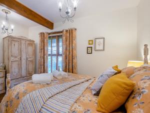 a bedroom with a bed with towels on it at Bockety Barn in Stalham