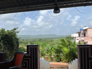 a view of the jungle from the balcony of a house at Spring Nature Stay in Kashid