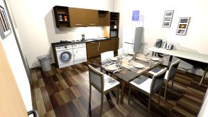 にあるOrt des Entstehensのテーブルと椅子のあるキッチンとダイニングルーム