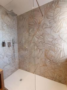 a bathroom with a shower with a wall at Casa Nanni in Genova +23 photos