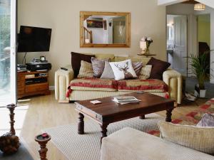a living room with a couch and a coffee table at Mill Haven in Dunster