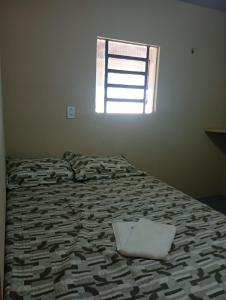 Postel nebo postele na pokoji v ubytování Espaço relax