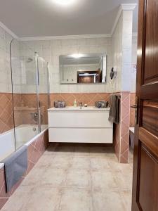 a bathroom with a sink and a shower at Villa Petra in Tuineje +47 photos