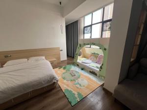 a bedroom with a bed and a crib with a baby in a mirror at Sheng Hai Yun Ju in Zhuhai +35 photos