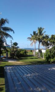 a street with palm trees on the side of a road at sunny's homestay in Singatoka