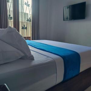 Postel nebo postele na pokoji v ubytování Griya Syariah Solo Homestay + 18 fotografií