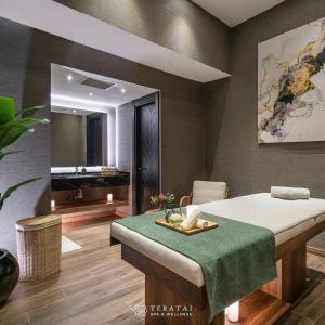 a bedroom with a bed with a table and a mirror at Grand Sapphire Hotel, Casino & Spa Holiday Deluxe Residential Home in Iskele