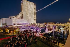 a crowd of people standing in front of a building at Grand Sapphire Hotel, Casino & Spa Holiday Deluxe Residential Home in Iskele +47 photos