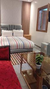 Ένα ή περισσότερα κρεβάτια σε δωμάτιο στο Riad Sevilla