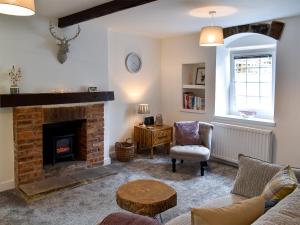 Posezení v ubytování Beckside Cottage