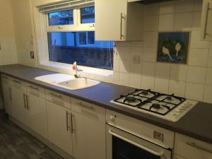 a kitchen with a sink and a stove top oven at Luxury Room in Leciester - Duncan3 in Aylestone