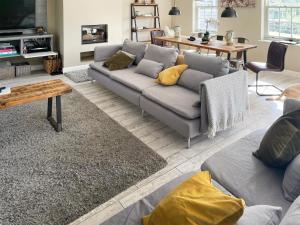 a living room with a couch and a table at Ivy Cottage in Beck Hole
