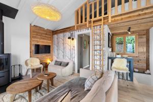 a living room with a couch and a table at Silverfox - 6 pers - belle vue in Plan Fey