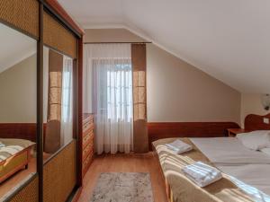 Postel nebo postele na pokoji v ubytování Willa Morfeusz