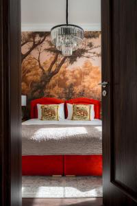 Ένα ή περισσότερα κρεβάτια σε δωμάτιο στο Piotrkowska 89 Residence