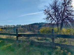 a wooden fence in the middle of a field at Na Żurawim Wzgórzu in Pasym +64 photos