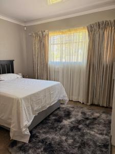 Ένα ή περισσότερα κρεβάτια σε δωμάτιο στο Gigi Lifestyle Cottage +4 φωτογραφίες