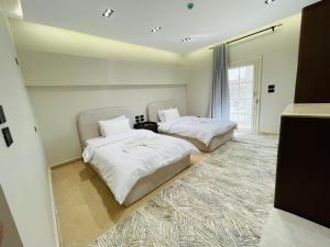 Ένα ή περισσότερα κρεβάτια σε δωμάτιο στο فندق ديزرت روز -Desert Rose Hotel