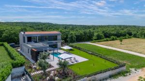 an aerial view of a house with a garden at Villa Visignano with private pool, BBQ and jacuzzi in Strpačići