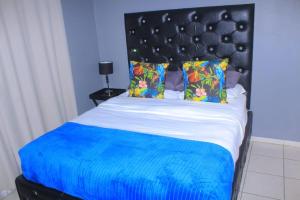 Ένα ή περισσότερα κρεβάτια σε δωμάτιο στο Zebra Family Unit