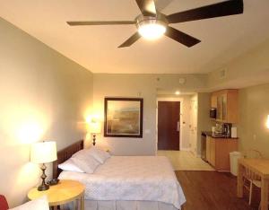 a bedroom with a bed with a ceiling fan at Bahia Sandestin Golf and Beach Resort in Destin