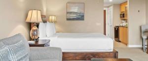 a hotel room with a bed and a couch at Bahia Sandestin Golf and Beach Resort in Destin +4 photos