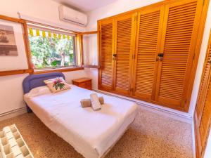 Кровать или кровати в номере Finca Tito y Yaya +32 фотографии