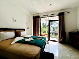 Ένα ή περισσότερα κρεβάτια σε δωμάτιο στο Eyeful Ella