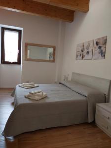 Ένα ή περισσότερα κρεβάτια σε δωμάτιο στο La Locanda del Barone