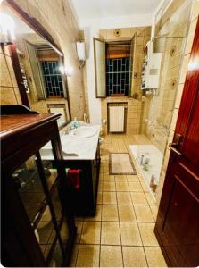 a bathroom with a sink and a bath tub at Bnb fantasia in Bologna +19 photos