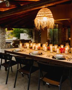 a long table with candles on it with chairs at QUIETE e MARE in San Vito lo Capo +97 photos