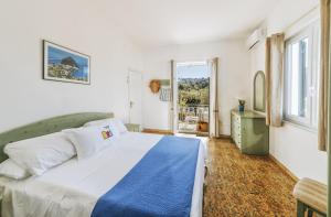 Postel nebo postele na pokoji v ubytování Lucia Maison